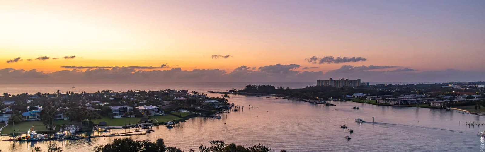 Aerial sunset view of the Jupiter Inlet and Intracoastal Waterway by Jupiter Coastal Media